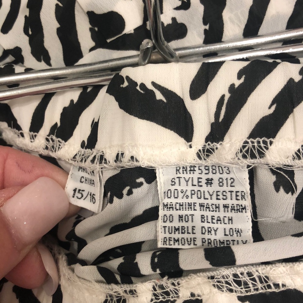 Black and white pleated polyester skirt soft wash and wear.